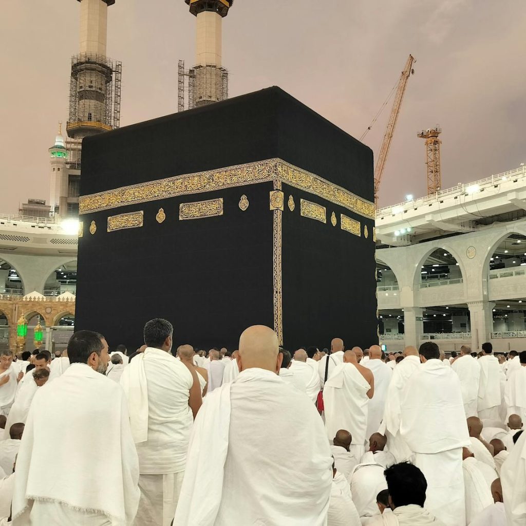 Pilgrims dressed in white gather around the Kaaba in Mecca's Grand Mosque, Saudi Arabia.